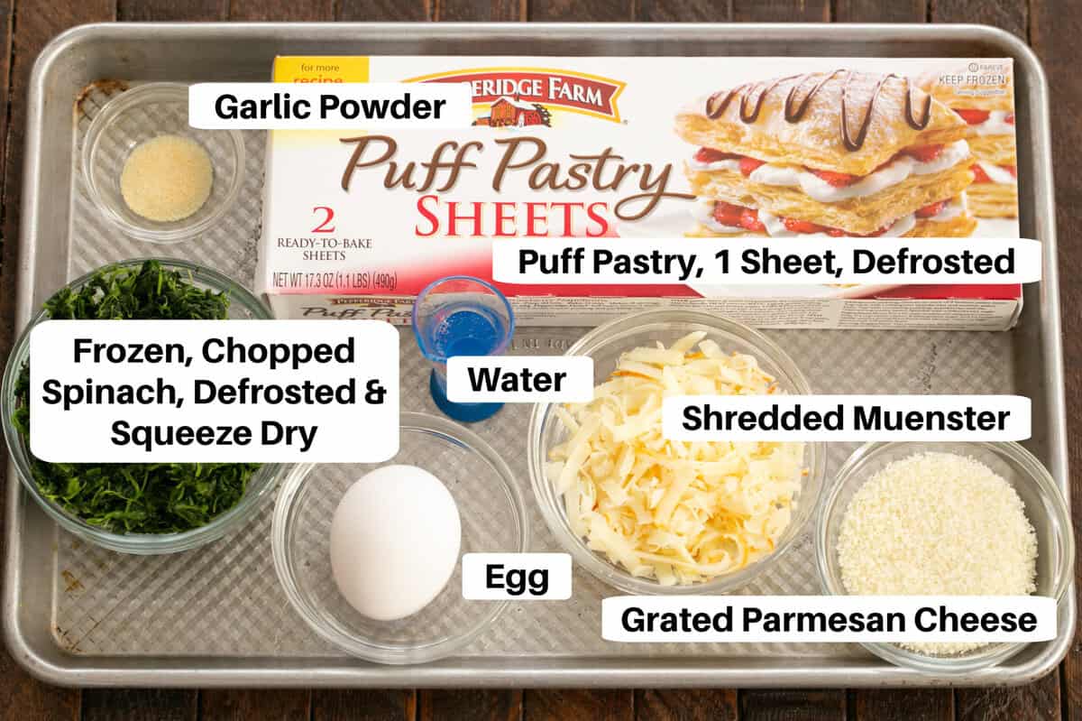 Muenster Spinach Pinwheel Ingredients on a sheet pan with labels.