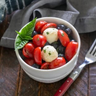 Blueberry Caprese Salad in a small salad bowl.