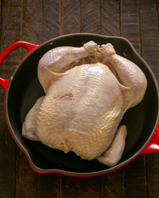 Marinated chicken in a roasting pan.