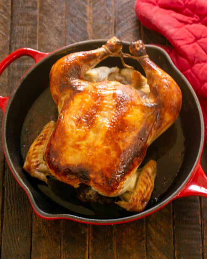 Cooked chicken in a roasting pan.